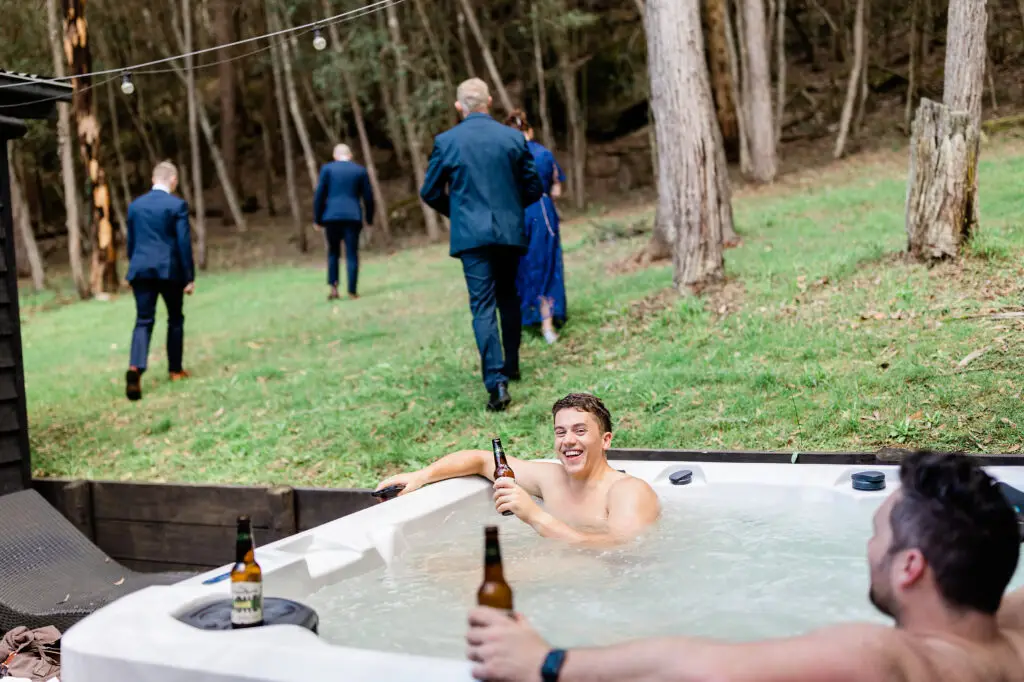 two men in the private outdoor spa at Mystwood wedding venue