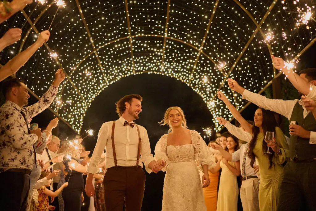 Two happy couples walking under the beautiful fairy lit dome at the Hunter Valley Wedding Venue