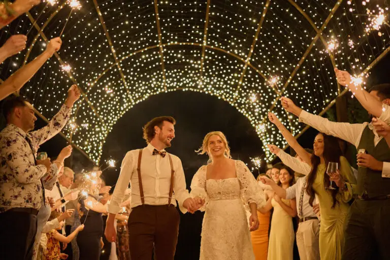 Two happy couples walking under the beautiful fairy lit dome at the Hunter Valley Wedding Venue