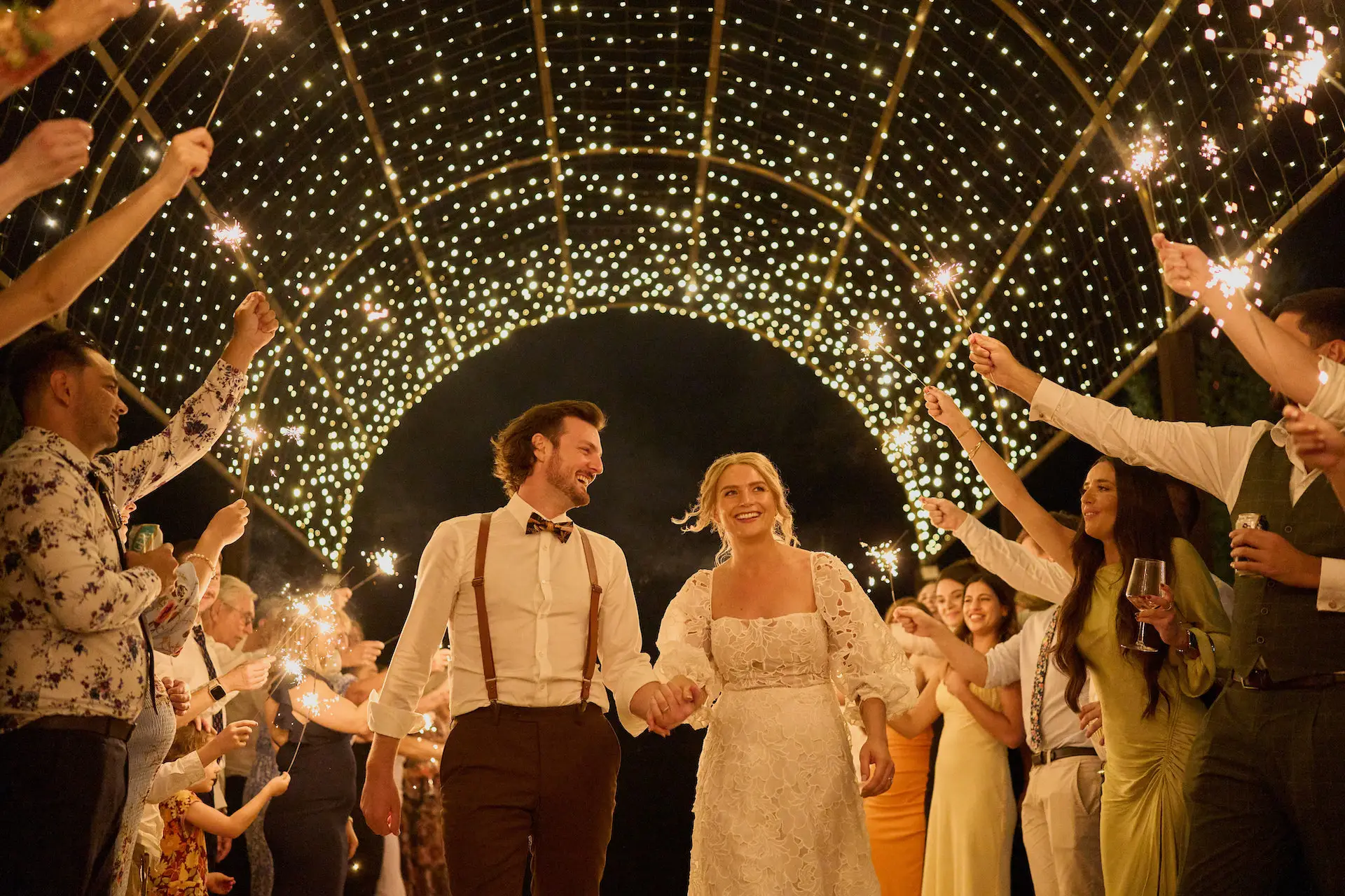 Two happy couples walking under the beautiful fairy lit dome at the Hunter Valley Wedding Venue