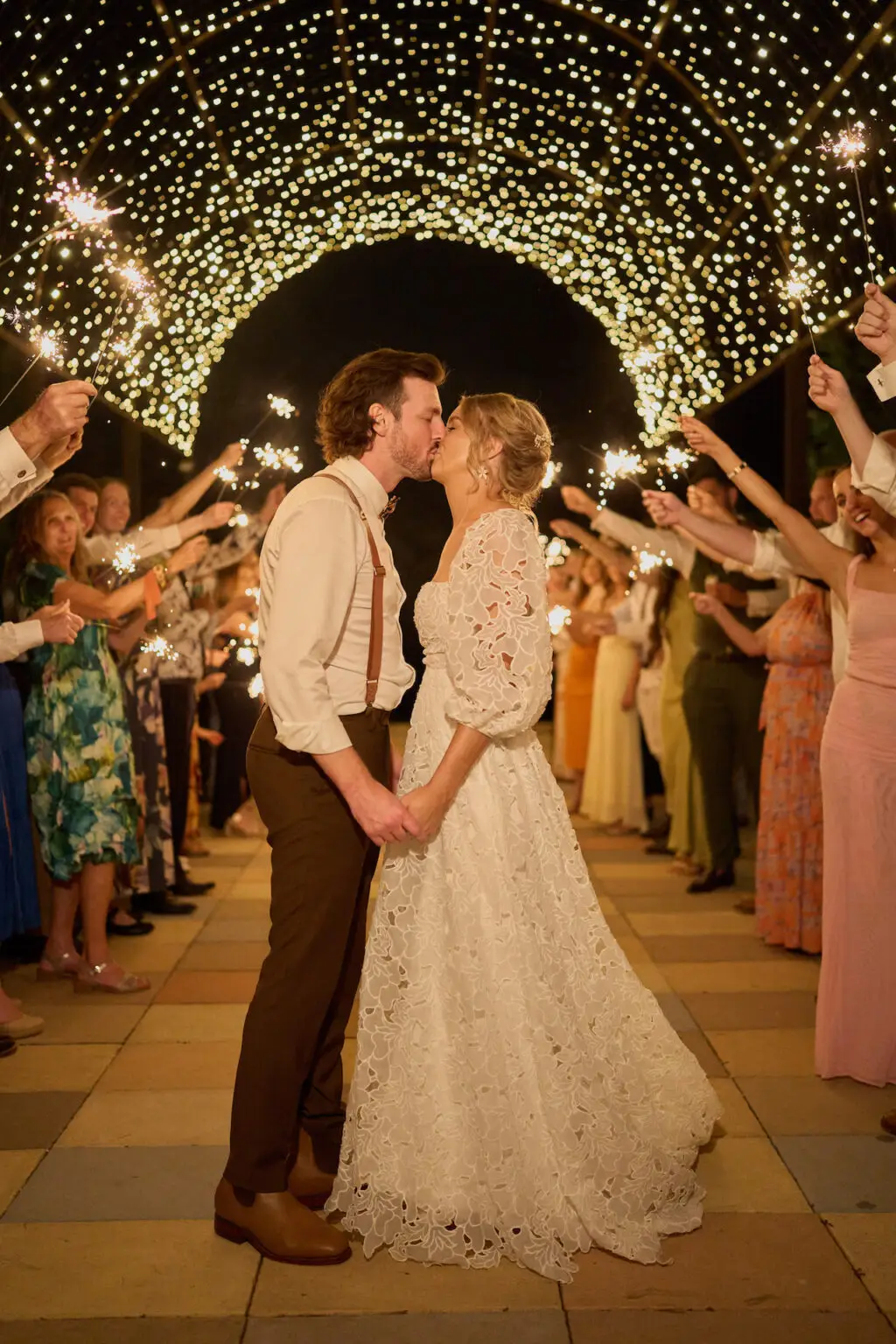 couple kissing under the fairy lit dome at Mystwood wedding venue
